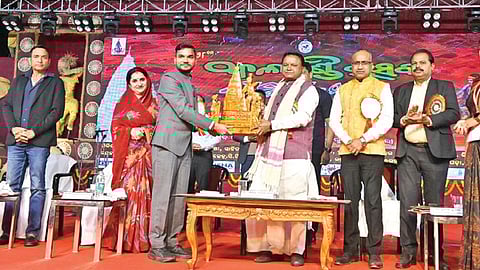 Chief Minister Mohan Charan Majhi being felicitated at the event on Sunday