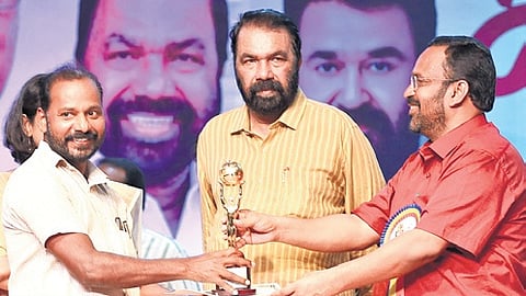 TNIE principal news photographer Vincent Pulickal receiving the best photographer award (print media – English - 2025) for coverage at the previous state school arts festival.