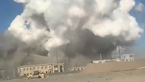 In this photo released by Xinhua News Agency, smoke rises from the site of explosions from a factory in Baotou, in north China's Inner Mongolia Autonomous Region, Sunday, Jan. 18, 2026.