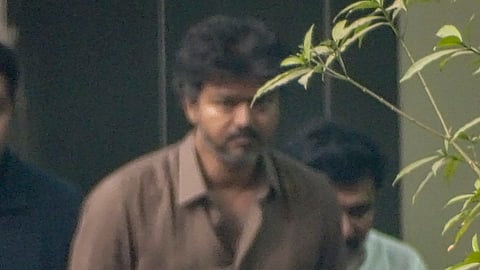  TVK chief Vijay arrives to appear before the CBI in connection with the Karur stampede case, in New Delhi, Monday, Jan. 19, 2026.
