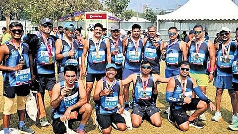Members of the Bhubaneswar Cycling and Adventure Club pose with their finisher’s medals at the Tata Mumbai Marathon 