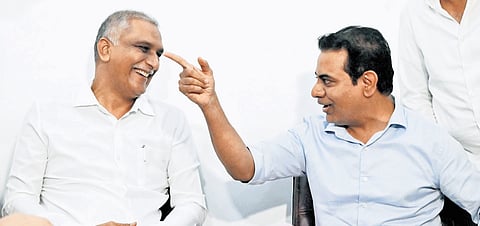 BRS leaders T Harish Rao and KT Rama Rao share a lighter moment at Telangana Bhavan on Tuesday.