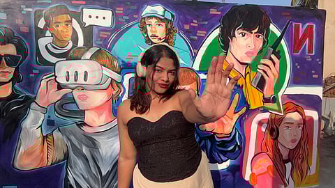 Bhoomika Ananth with a wall inspired by Stranger Things