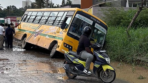 Screengrab from a video from Bengaluru that went viral on social media in September last year. The video shows a bus ferrying 20 children got stuck and and dangerously tilted  