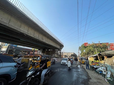 The existing HT power lines that currently pass across the national highway stretch have been obstructing deck slab works near the Saibaba Colony Police Station.