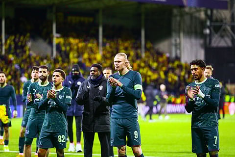 Manchester City's Erling Haaland, center, applauds the crowd after the Champions League.