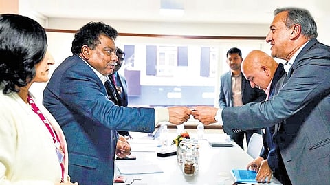 Karnataka Minister for Large and Medium Industries MB Patil interacts with UPL chairman and group CEO Jai Shroff, in Davos on Tuesday.
