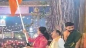 Video grab of Udupi DC Swaroopa T K waving saffron flag for the commencement of Paryaya Procession in Udupi on Sunday, Jan 18, 2026.
