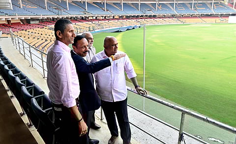 (From L) KSCA president Venkatesh Prasad, and other KSCA office bearers take a look at the ground at the M Chinnaswamy Stadium on Wednesday