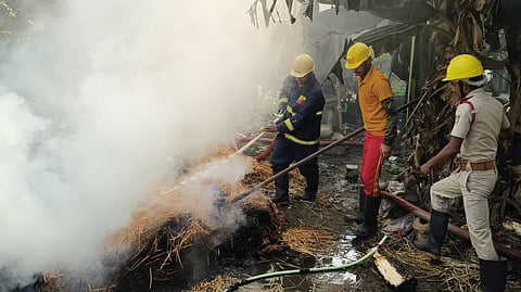 Fire services personnel dousing the flames at Pipal village 