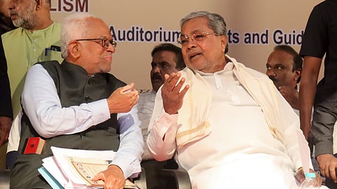 CM Siddaramaiah interacts with (R) Justice Sudershan Reddy (retd) during the South Indian Socialist Conference in Bengaluru on Tuesday.