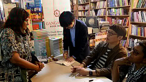 Satoshi Yagisawa (second from right) during a book signing at Gangarams Book Bureau on Wednesday