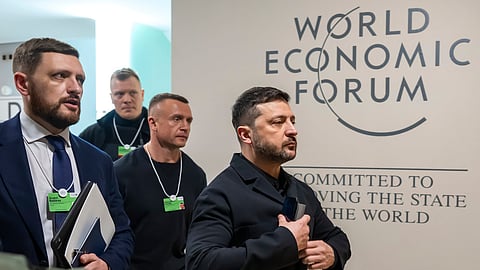 Ukraine's President Volodymyr Zelenskyy, right, arrives for the Annual Meeting of the World Economic Forum in Davos, Switzerland, Thursday, Jan. 22, 2026.