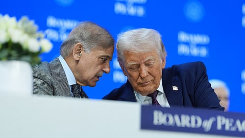 US President Donald Trump, right, speaks with Mian Muhammad Shehbaz Sharif, Prime Minister of Pakistan, during a signing of the Board of Peace charter during the Annual Meeting of the World Economic Forum in Davos, Switzerland, Thursday, Jan. 22, 2026.