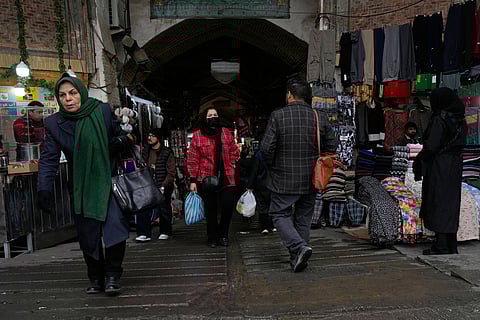 People walk at Tehran's historic Grand Bazaar, Tuesday, Jan. 20, 2026, in Iran