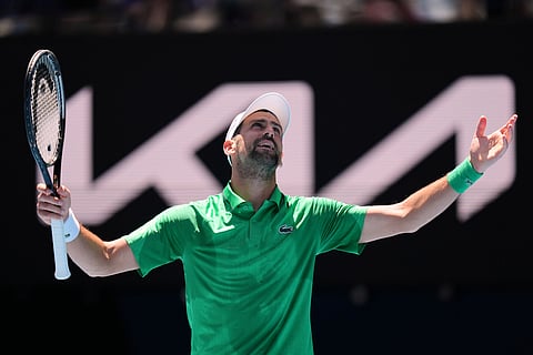 Novak Djokovic of Serbia reacts during his second round match against Francesco Maestrelli of Italy at the Australian Open tennis championship in Melbourne, Australia, Thursday, Jan. 22, 2026.
