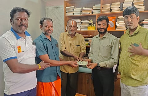 Sundaramoothy (Red dhoti) donating money to Muneeswaran Manager of old-age home in Thiru nagar in Madurai city.