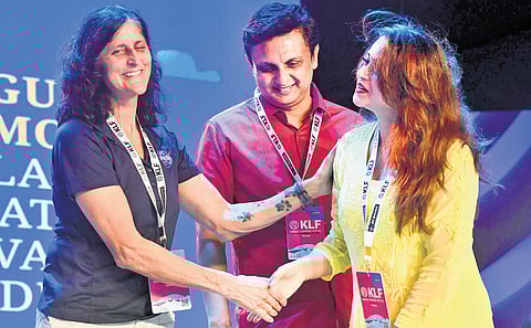 Actor Bhavana greets former astronaut Sunita Williams at the opening ceremony of the Kerala Literature Fest in Kozhikode on Thursday. Tourism and Works Minister P A Mohamed Riyas looks on 