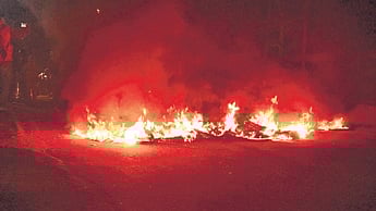 Tyres burning on Jagatsinghpur-Alipingal road at Haat Bazaar.