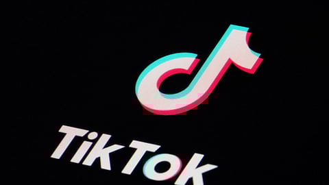 FILE - The icon for the TikTok video sharing app is seen on a smartphone
