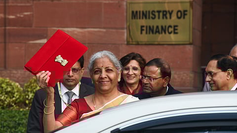 Union Finance Minister Nirmala Sitharaman shows the budget tablet at the Ministry of Finance before heading to the Parliament to present the Union Budget 2025 in New Delhi.