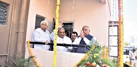 AICC president Mallikarjun Kharge, Chief Minister Siddaramaiah, and ministers HK Patil and BZ Zameer Ahmed Khan at the balcony of a newly inaugurated housing complex on Mantoor Road in Hubballi on Saturday.
