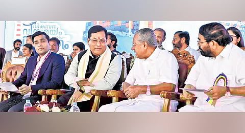 Union Minister for Ports, Shipping and Waterways Sarbananda Sonowal and Chief Minister Pinarayi Vijayan interact at the inauguration of the second phase construction of the Vizhinjam port on Saturday. Adani Ports and SEZ MD Karan Adani and Ports Minister V N Vasavan are also seen 