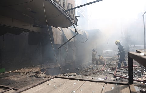 Rescue operations being carried out after a fire broke out at a furniture shop in Nampally, Hyderabad.
