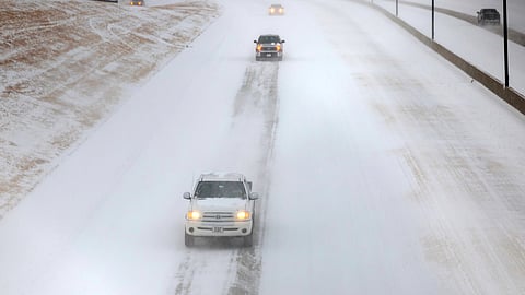 Traffic moves west in the snow on I244 east of Yale Ave. Saturday, Jan. 24, 2026 in Tulsa, Okla.