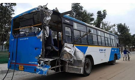 BMTC bus damaged after it reversed into a moving train at Kadugodi~BMTC bus reversed into moving train in Kadugodi