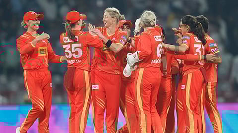 Sophie Devine (3rd from left) celebrates a wicket with her teammates