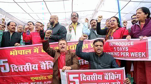 Bank employees, under the banner of the United Forum of Bank Unions (UFBU), protest demanding the implementation of a five-day banking week in Bhopal. 