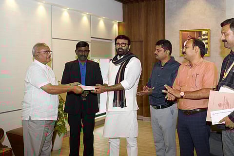 The first beneficiary, Asif Ali Niyaz, who gave up 4 guntas of his land for the project, received two cheques of Rs 28.80 lakh each, amounting to a total compensation of Rs 57.60 lakh.