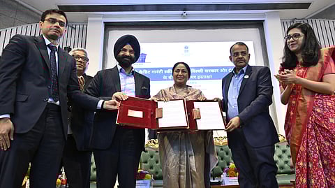 Dheeraj Kumar, DGM,CGTMSE, (L) and Ravi Jha, secretary (Industries) (2nd R) seen exchange the document after an MoU signing agreement with Delhi Government between CGTMSE, for Delhi Credit Guarantee Scheme, in the presence of Delhi Chief Minister Rekha Gupta and Minister of Industries, Manjinder Sigh Sirsa and others at Delhi Secretariat in New Delhi on Tuesday.
