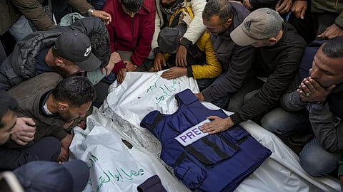 Relatives and friends mourn over the bodies of five Palestinian journalists who were killed by an Israeli airstrike in Gaza City at the Al-Aqsa Hospital in Deir al-Balah in the early months of the war 