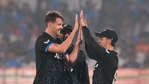 New Zealand's Jacob Duffy, left, celebrates with teammates after taking the catch of India's captain Suryakumar Yadav during the fourth T20I cricket match between India and New Zealand. (Photo | PTI)