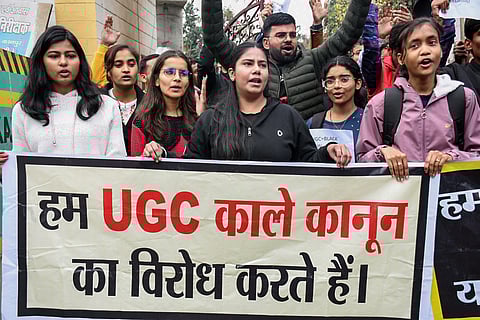 Students of Chandrashekhar Azad Agricultural University stage a protest against UGC’s new caste-based equality rules in colleges, in Kanpur on Wednesday.