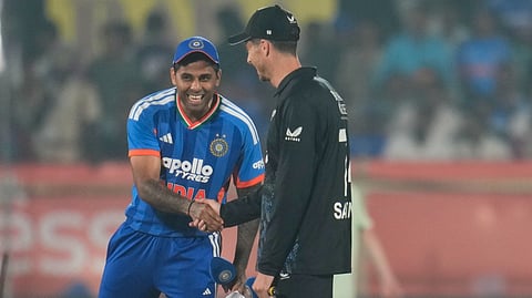India's captain Suryakumar Yadav, left, shake hands with New Zealand's captain Mitchell Santner after the toss ahead of the fourth T20 cricket match between India and New Zealand in Visakhapatnam, India, Wednesday, Jan. 28, 2026. 