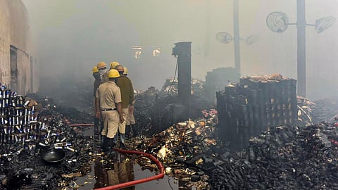 Fire brigade personnel douse a fire at a warehouse, in Kolkata, Monday, Jan. 26, 2026. A fire broke out in a warehouse in the Nazirabad area of Anandapur, Kolkata, in the early hours of Monday.