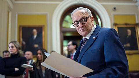 Senate Minority Leader Chuck Schumer, D-N.Y., waits to speak to reporters following a closed-door meeting with fellow Democrats.