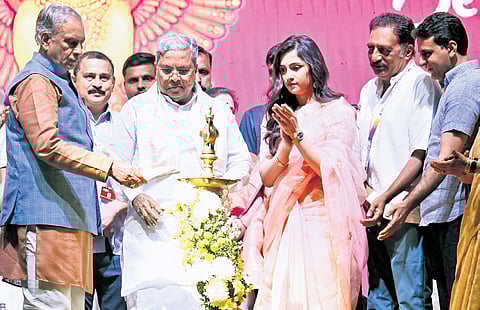 Chief Minister Siddaramaiah inaugurates the 17th edition of Bengaluru International Film Festival on Thursday. Actors Rukmini Vasanth and Prakash Raj look on.
