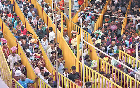 Devotees queue up at Medaram to offer prayers at the altar on Friday