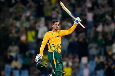 South Africa's batsman Quinton de Kock raises his bat after reaching a century during the T20 International cricket match between South Africa and West Indies, in Centurion, South Africa, Thursday, Jan. 29, 2026.