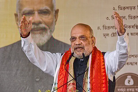 Union Home Minister Amit Shah addresses a public meeting, in Dibrugarh, Friday, Jan. 30, 2026. 