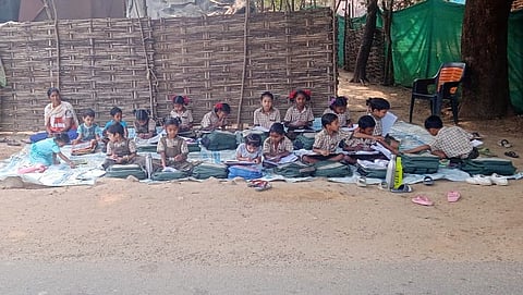 Due to non payment of rent, owner locked school gate and teachers conducted classes under a tree after they were unable to enter the campus.