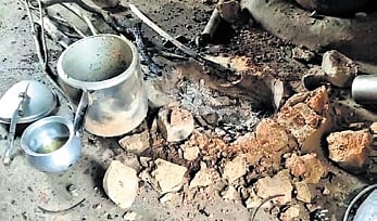 Broken earthen stove and cooker of the kitchen where the incident took place