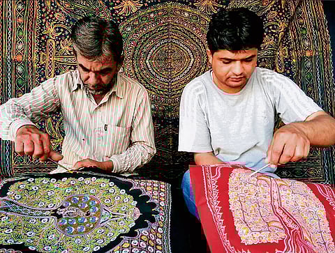 Abdulgafur and Sumar Daud Khatri making tree of life
