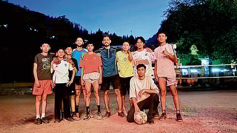 Local football players with their coach