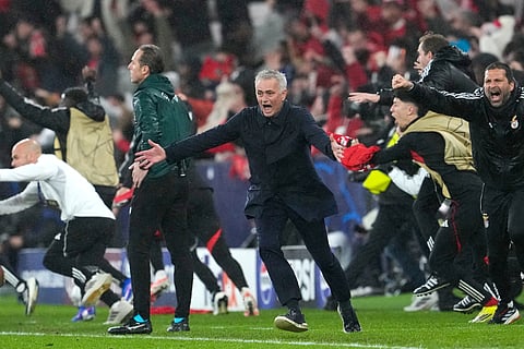 Benfica's head coach Jose Mourinho runs celebrating at the end of a Champions League match between Benfica and Real Madrid in Lisbon.