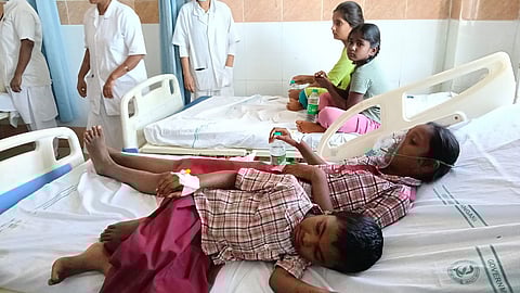 Students of primary school in Venkatapur of Narayankhed mandal being treated in the government hospital in Narayankhed, Sangareddy district, on Thursday.